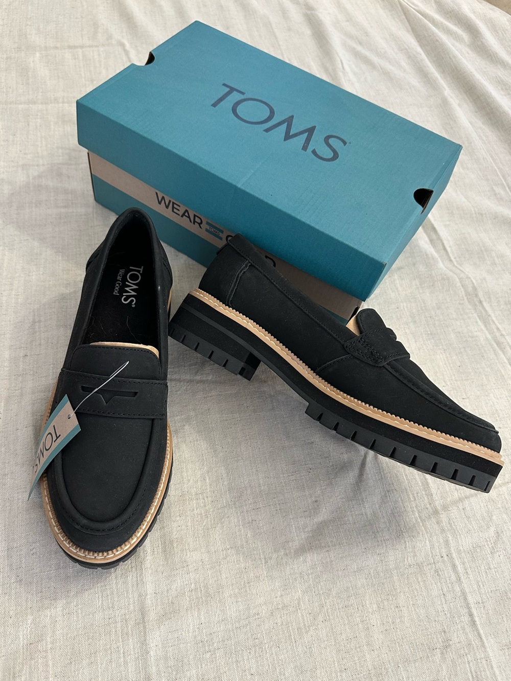 TOMS Black Penny Loafers with Tan Welt